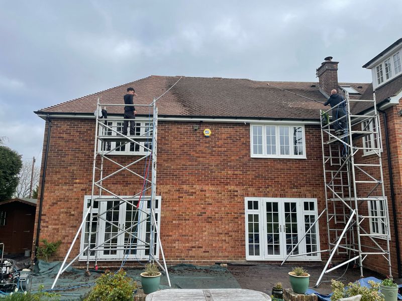Roof cleaning carried out safely from scaffold towers by The Roof Moss Cleaners in Wisbech